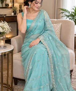 Ice Blue Butterfly Net Saree 5 Ice blue butterfly net saree with sequin and thread embroidered border and sleeveless stitched blouse